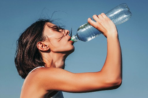 Image of woman drinking water