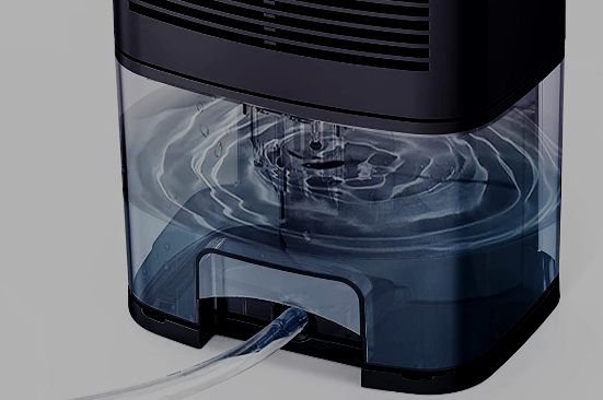 image of small dehumidifier with drain hose